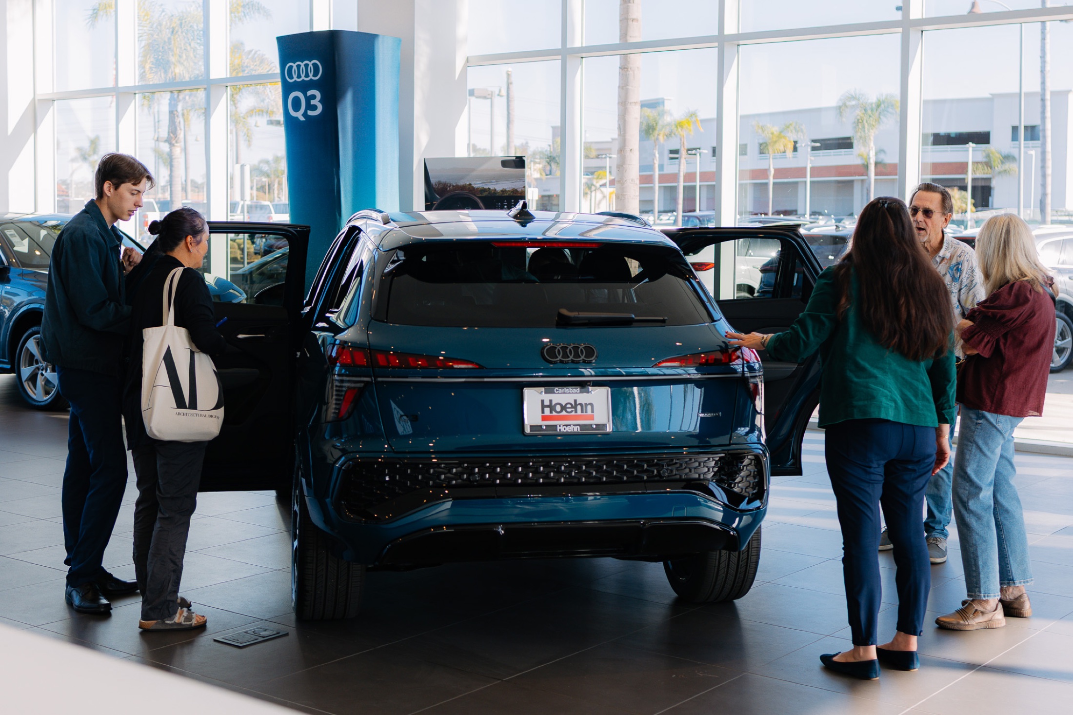 Guests exploring the all-new Q3 in the Audi Carlsbad showroom during the open house